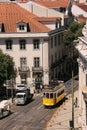 Trolley passing through narrow street of Lisbon