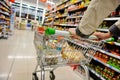 Trolley in a Supermarket Grocery Aisle Royalty Free Stock Photo