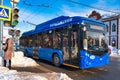 A trolleybus stands at a traffic light in the city of Yoshkar-Ola.