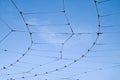 Trolleybus wires against a blue sky with white clouds Royalty Free Stock Photo