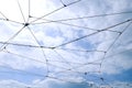 Trolleybus wires against a blue sky with white clouds Royalty Free Stock Photo