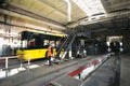 Trolleybuses parked at the trolley depot hangar for technical inspection, workers working