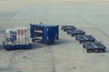 Trolleys for luggage containers on the airfield Royalty Free Stock Photo