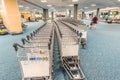 Trolleys for luggage of passengers in the airport building Royalty Free Stock Photo