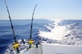 Trolling offshore fisherboat rod reels wake sea Royalty Free Stock Photo