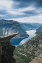 Trolltunga, view on troll tongue reef over the lake. Beautiful nature. Tourist popular place. Ringedalsvatnet, Odda, Norway. Royalty Free Stock Photo