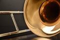 Trombone bell and slide detail front view black background Royalty Free Stock Photo