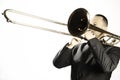 Trombone player. Trombonist playing jazz musician  on white Royalty Free Stock Photo