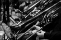 Trombones in the hands of the musicians Royalty Free Stock Photo