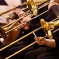 Trombones in the hands of musicians