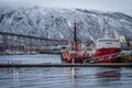 Tromso Bridge across Tromsoysundet strait and Tromso harbour Royalty Free Stock Photo