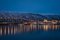 Tromso Bridge across Tromsoysundet strait at night Royalty Free Stock Photo