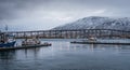 Tromso Bridge across Tromsoysundet strait and Tromso harbour Royalty Free Stock Photo