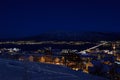 Tromso city at winter snowy night with light,traffic,fjord and motion with mainland Royalty Free Stock Photo