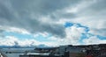 Tromso Cityscape with Snow-Covered Mountains and Cloudy Sky Royalty Free Stock Photo