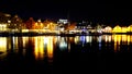 Night view of waterfront buildings in Tromso, Norway.