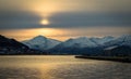 Tromso mountains clouds light and sun Troms County, northern Norway Royalty Free Stock Photo