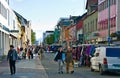 Tromso Norway, old town street with tourists Royalty Free Stock Photo