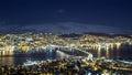 Tromso city night panorama, view from the mountains towards bridge and Arctic Cathedral Royalty Free Stock Photo