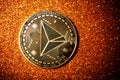TRON coin on dark background close up