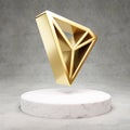 Tron cryptocurrency icon. Gold 3d rendered icon on white marble podium