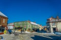 TRONDHEIM, NORWAY - APRIL 04, 2018: Traditional Scandinavian wooden buildings stand along old street in Trondheim