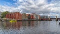 Trondheim River Nidelva Dockside Warehouses and Bridge Royalty Free Stock Photo