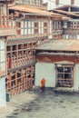 Trongsa, Bhutan - September 13, 2016: Bhutanese monk standing in the backyard of Trongsa Dzong, Bhutan