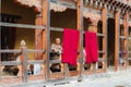 Trongsa, Bhutan - September 12, 2016: Happy Bhutanese man watching the backtyard of Trongsa Dzong, Bhutan