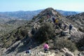 Group of hikers, hiking on a nature trail at the top of a cliff. Healthy lifestyle. People active outdoors