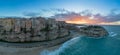 view of Rotonda Beach and the colourful old town of Tropea in Calabria at sunset