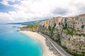 Tropea town and beach, Tyrrhenian Sea, colorful buildings on top of high big rocks, view from Sanctuary church of Santa Maria dell Royalty Free Stock Photo