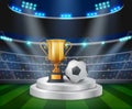 Trophy and soccer ball on the podium with a football stadium background