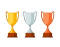 Trophy winner Cups with wooden base isolated on white background. Gold, silver and bronze prize award cups icon Royalty Free Stock Photo