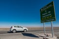 Tropic of Capricorn sign and blurred car in Atacama Desert, Chile - South America