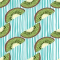 Tropic fruit seamless pattern with kiwi simple slice shapes. Blue and white striped background