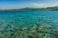 Tropic island idyllic picturesque landscape summer June day scenic view of sea bay shallow water foreground space and shore line