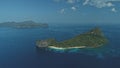 Tropic island at ocean bay aerial view. Boats and ships at harbor. Tropical forest on mountain isle Royalty Free Stock Photo