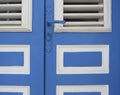 Caribbean blue and white entrance door close-up. Tropical architecture. Martinique, Antilles French West Indies Royalty Free Stock Photo