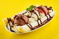 Tropical banana split with chocolate drizzle Royalty Free Stock Photo