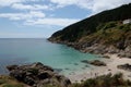 Tropical bay in the municipality of Fisterra with green cliffs in Coruna, Galicia, Spain Royalty Free Stock Photo