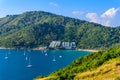 Tropical bay at Naiharn and Ao Sane beach with boats at windmill viewpoint, Paradise destination Phuket, Thailand