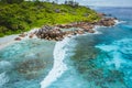 Tropical beach Anse Cocos. La Digue island. Seychelles. Drone aerial view of coastline with blue ocean waves, unique Royalty Free Stock Photo