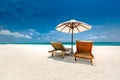 Luxury beach resort, beach loungers near the sea with white sand over sea Topical island background, summer vacation concept Royalty Free Stock Photo