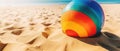 Tropical beach ball on sand, ocean summer holiday background colorful beach ball in sand