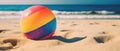 Tropical beach ball on sand, ocean summer holiday background colorful beach ball in sand