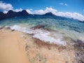 Tropical beach and blue sea water landscape with fisheye lens. Clear blue sea water over yellow sand beach