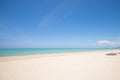 Tropical beach with blue sky and calm blue sea surf