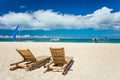 Tropical beach with chaise longues Royalty Free Stock Photo