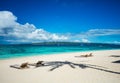 Tropical beach with chaise longues Royalty Free Stock Photo